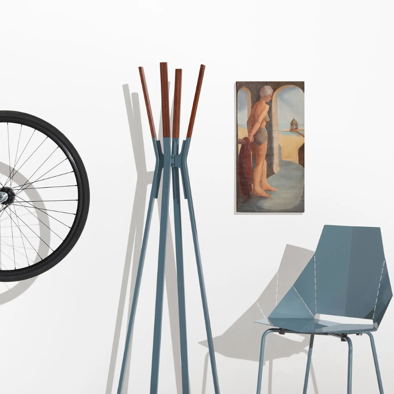 The Splash Coat Rack from Blu Dot in marine blue in a living room.