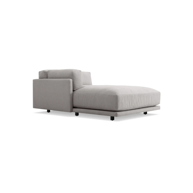The left Sunday Chaise by Blu Dot in agnew grey from a side angle.