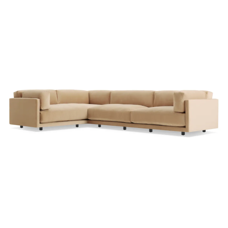 The Sunday L Sectional Sofa by Blu Dot in camel velvet with left chaise from an angle.