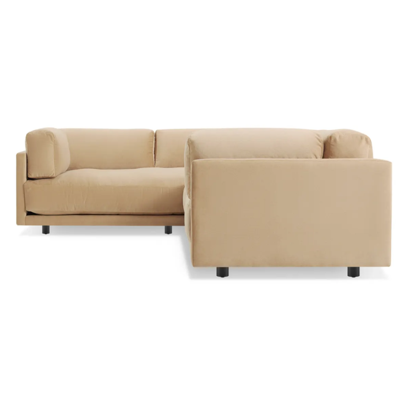 The Sunday L Sectional Sofa by Blu Dot in camel velvet with left chaise from the side.