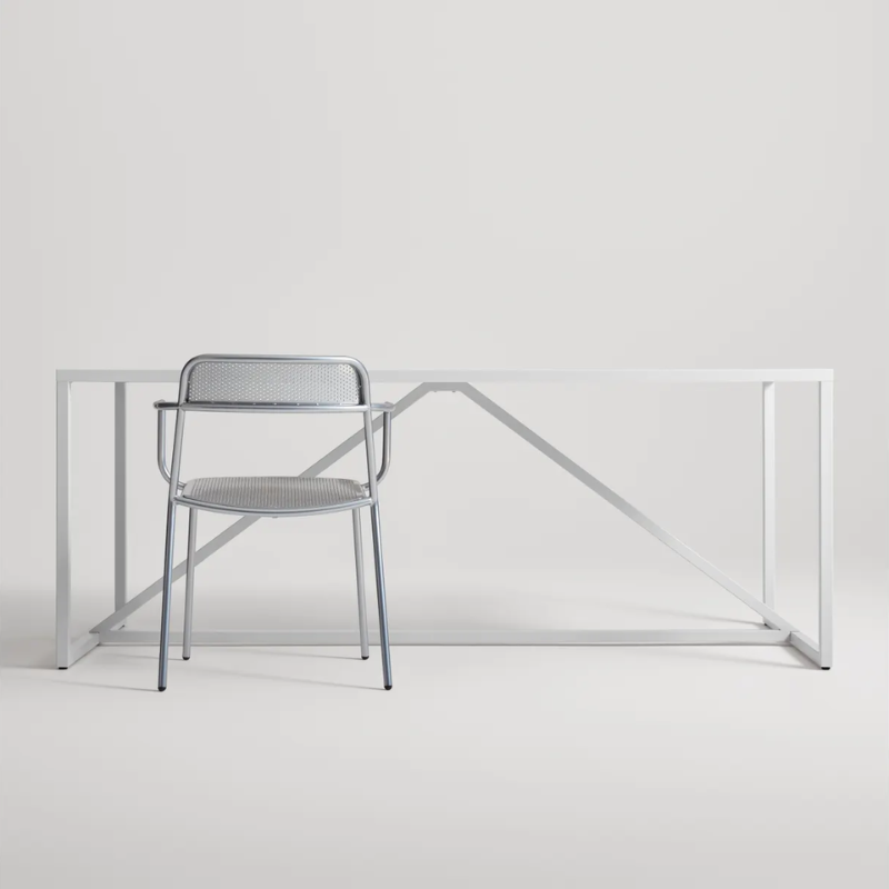 The Trim Armchair from Blu Dot in a studio office.