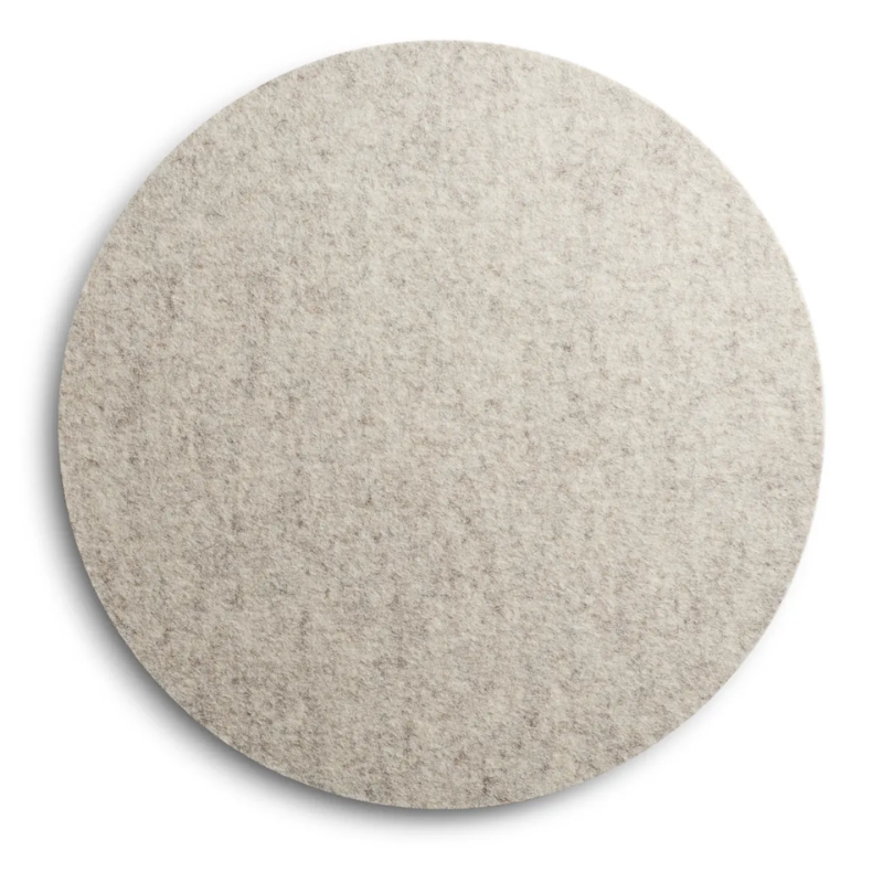 A Turn Stool Felt Top from Blu Dot in heathered off white.