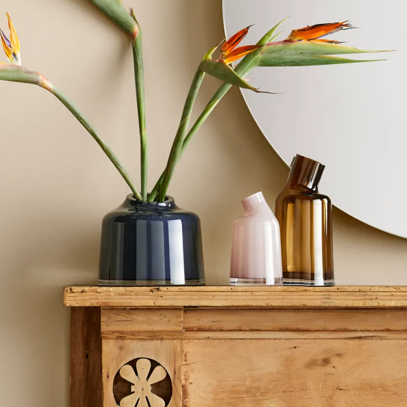 The Variant Medium Glass Vase from Blu Dot in a family room.
