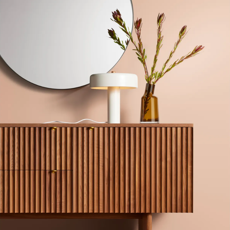 The Variant Medium Glass Vase from Blu Dot in a primary bedroom.