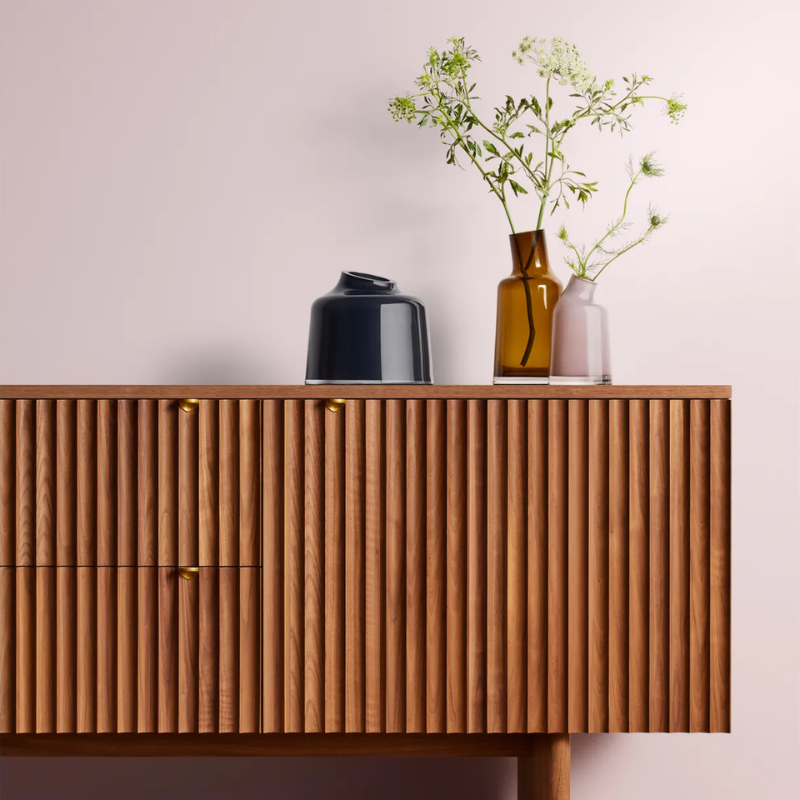 The Variant Small Glass Vase from Blu Dot in a living room.