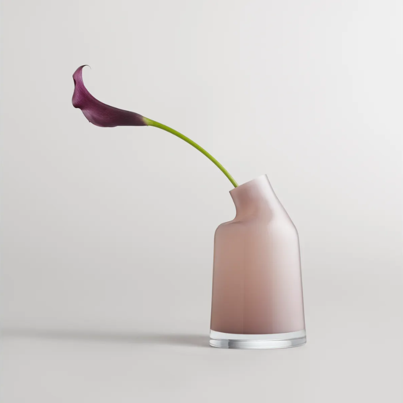 The Variant Small Glass Vase from Blu Dot in a living space with a flower.