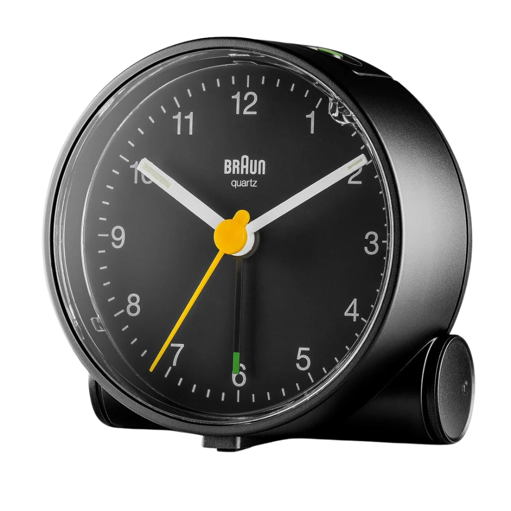 The black Round Alarm Clock BC01 by Braun from a side angle.