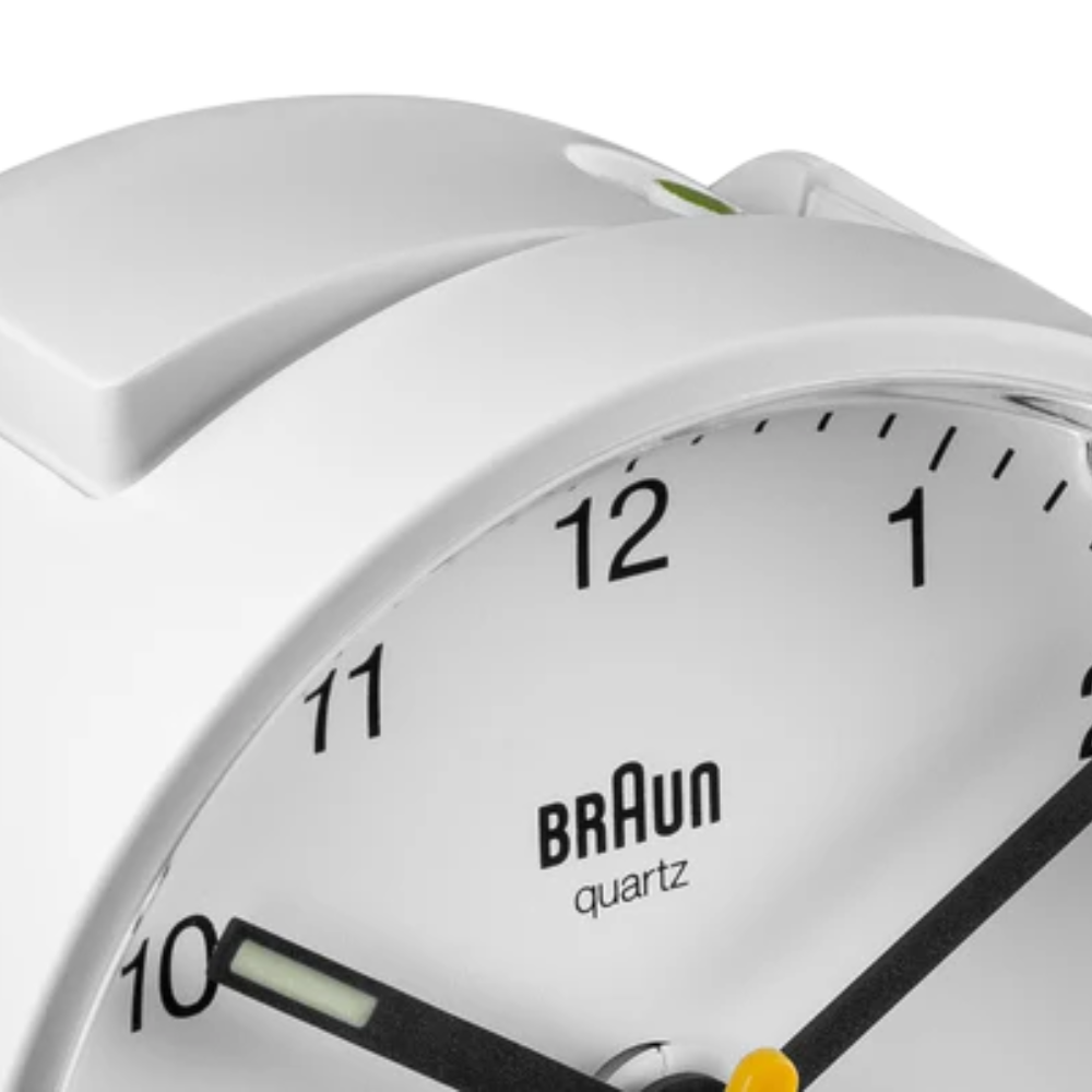 The white Round Alarm Clock BC01 by Braun from the top close-up.