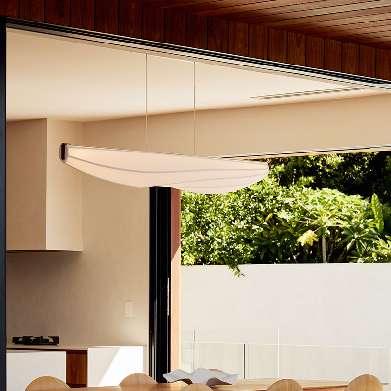 The Lenis Linear Pendant from Cerno in dark stained walnut in a dining room.