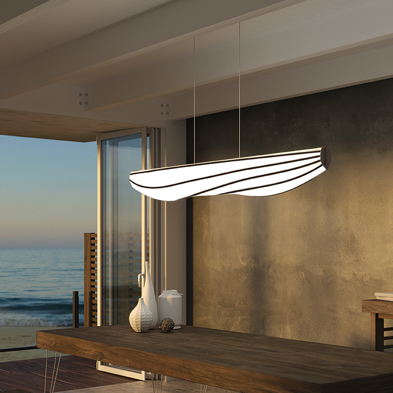 The Lenis Linear Pendant from Cerno in walnut in a workspace.