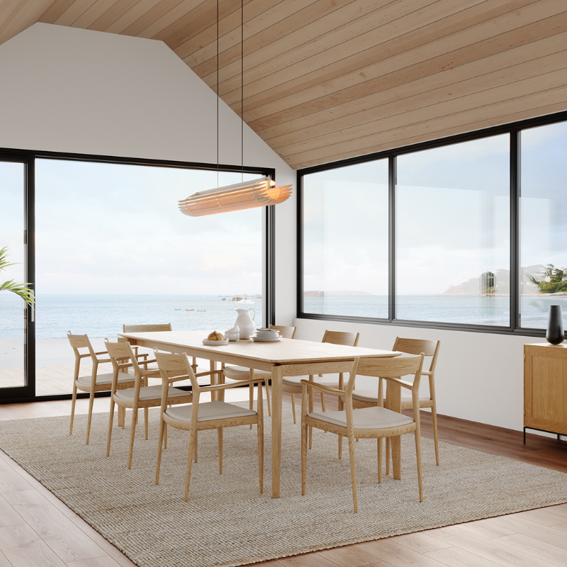 The Lex Linear Pendant from Cerno in white washed oak in a living room.