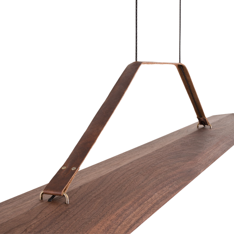 The Penna Linear Pendant from Cerno in dark stained walnut close up.