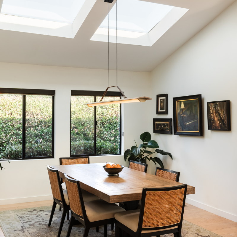 The Penna Linear Pendant from Cerno in a living space.