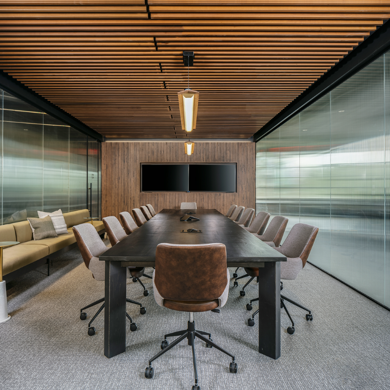 The Penna Linear Pendant from Cerno in a meeting room.