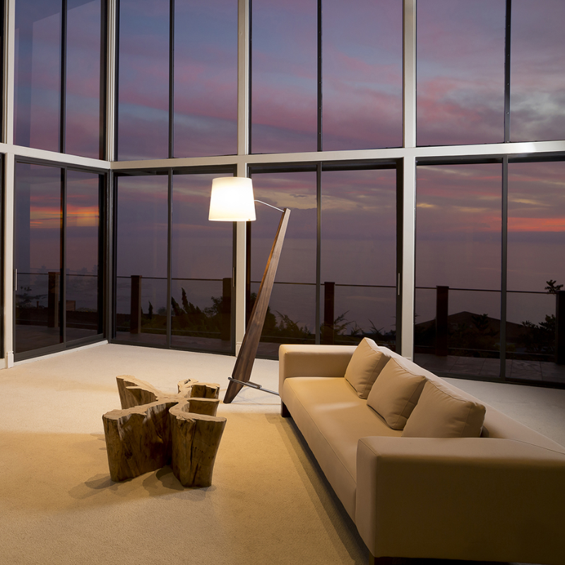 The Silva Giant Floor Lamp from Cerno in dark stained walnut in a family area.