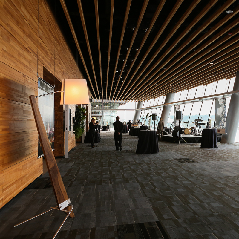 The Silva Giant Floor Lamp from Cerno in walnut in a commercial space.