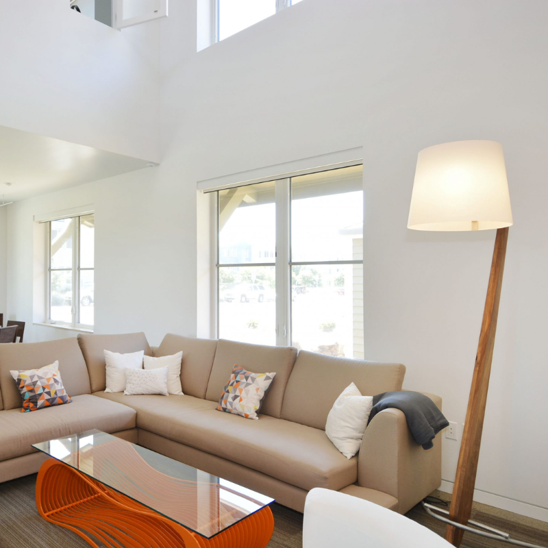 The Silva Giant Floor Lamp from Cerno in walnut in a living room.