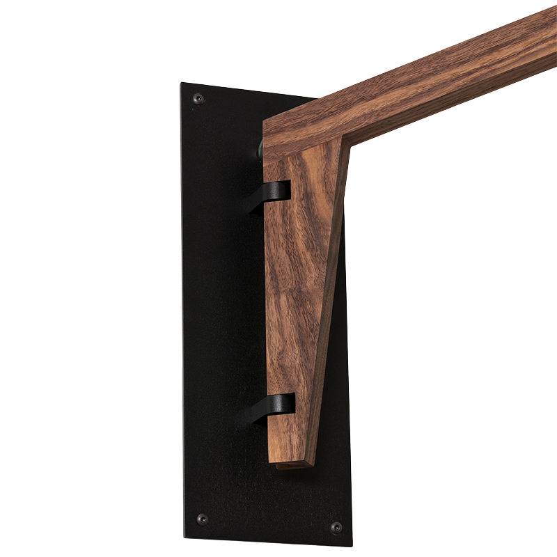 The Talea Wall Sconce Swing Arm from Cerno in textured black powder and walnut in a close-up. all-groups