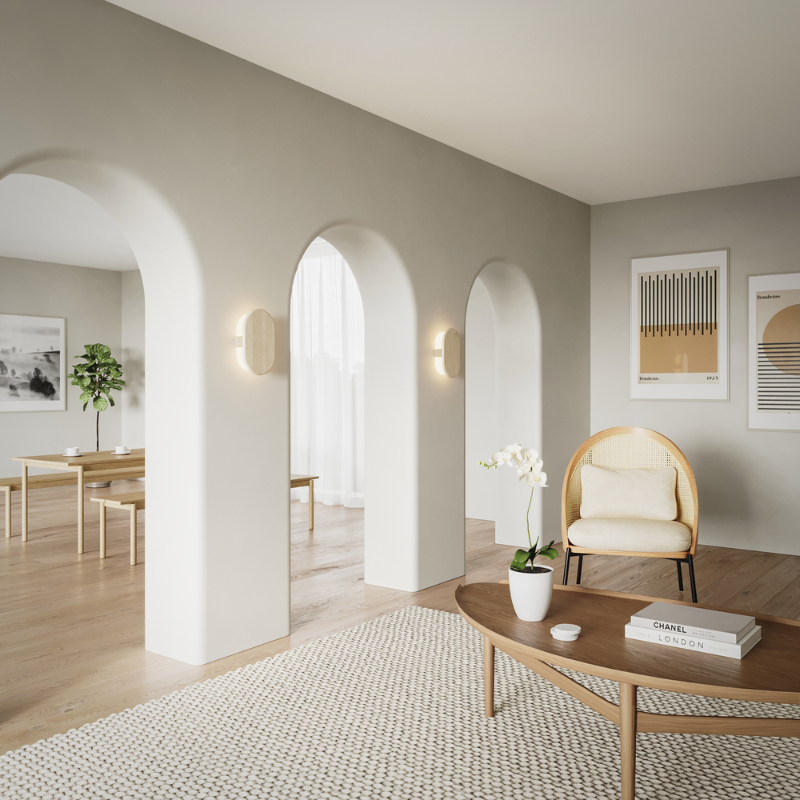 The Tempus Wall Sconce from Cerno in white washed oak in a living room.