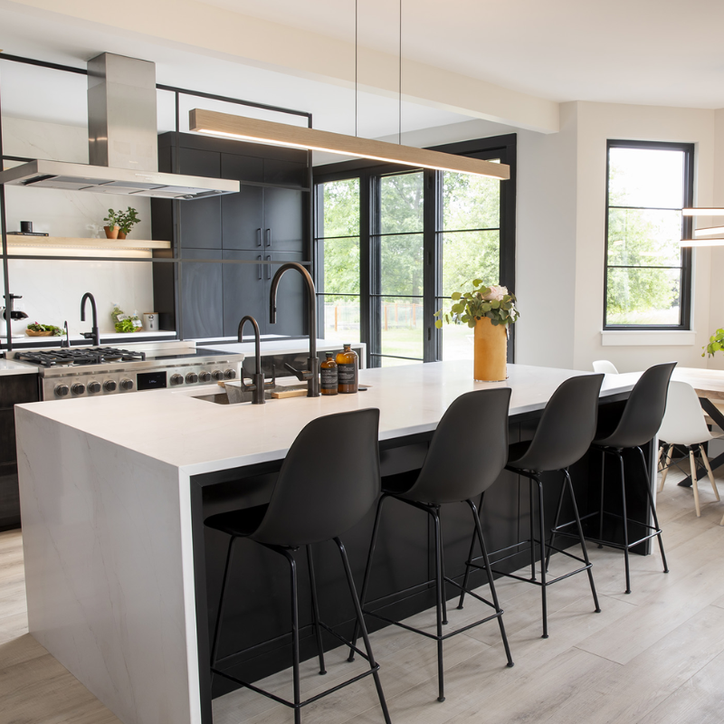 The Una LED Linear Suspension – Uplight and Downlight from Cerno in white washed oak in a designer home.