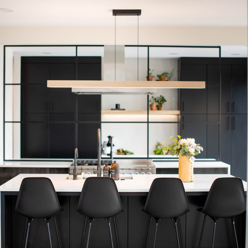 The Una Linear Pendant – Downlight Only from Cerno in white washed oak in a living area.