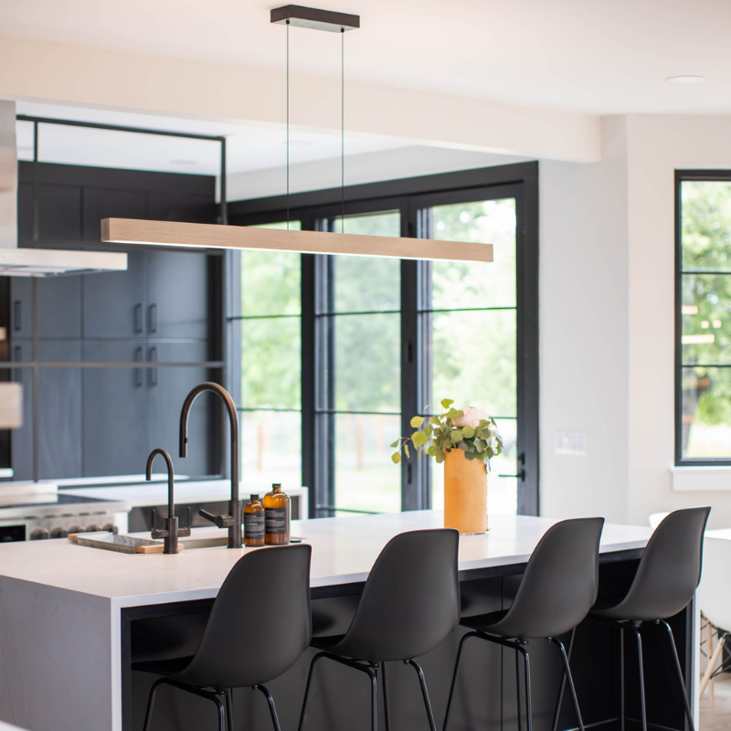 The Una Linear Pendant – Downlight Only from Cerno in white washed oak in a living space.