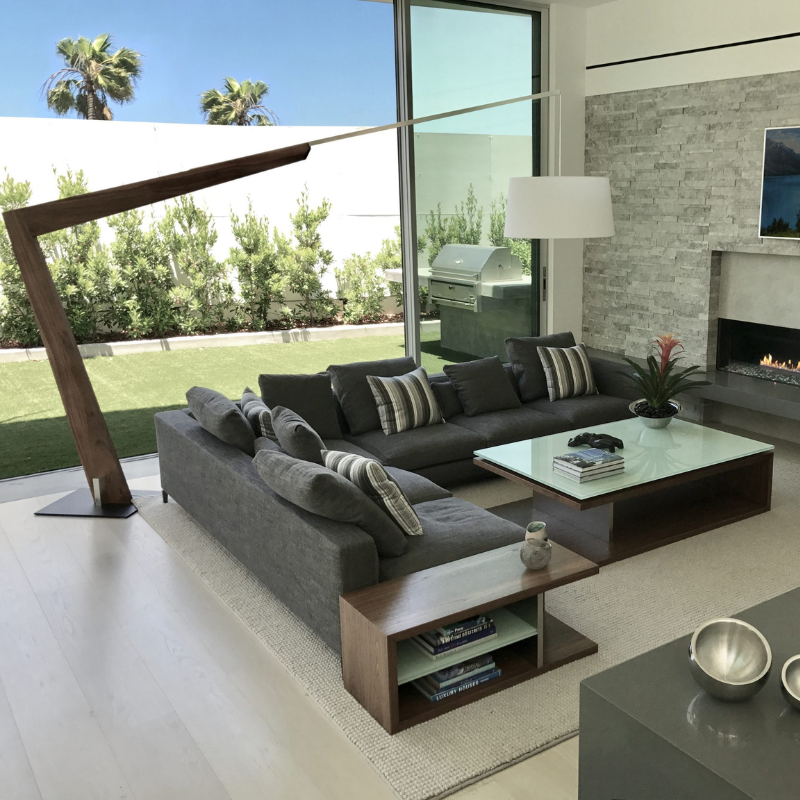 The Valeo Floor Lamp from Cerno in dark stained walnut in a lounge.