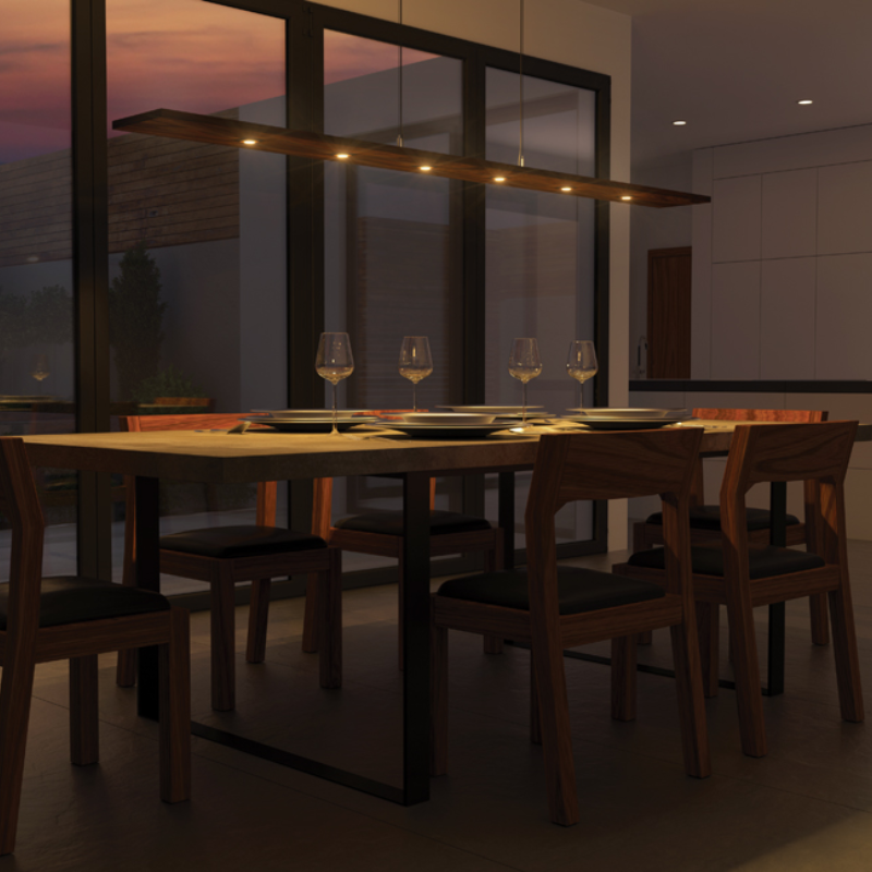 The Vix 82 Linear Pendant from Cerno in a dining room.