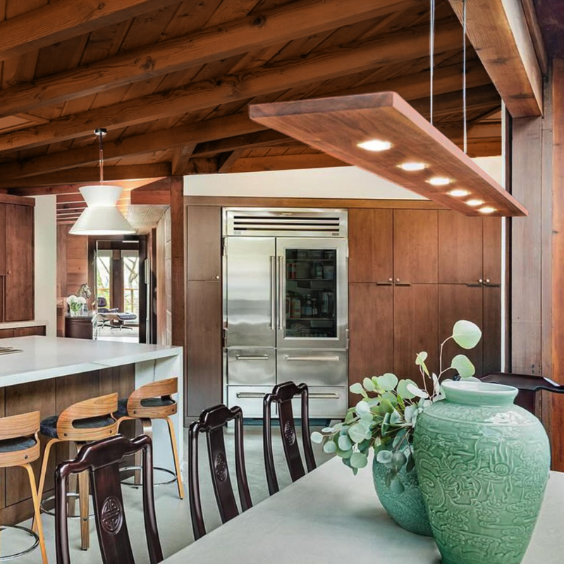 The Vix 82 Linear Pendant from Cerno in a kitchen and dining area.