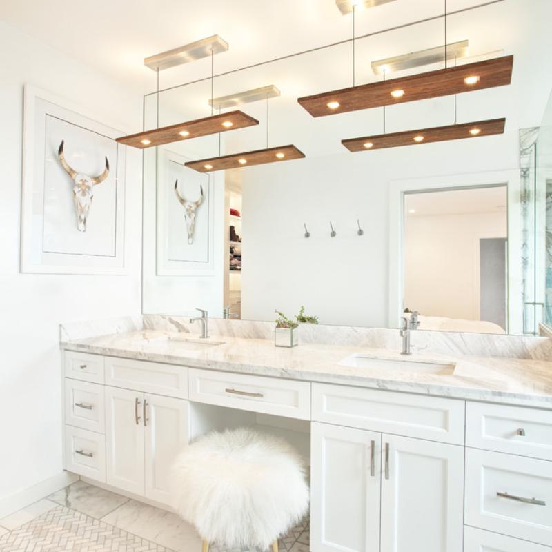 The Vix Linear Pendant from Cerno in walnut in a bathroom.