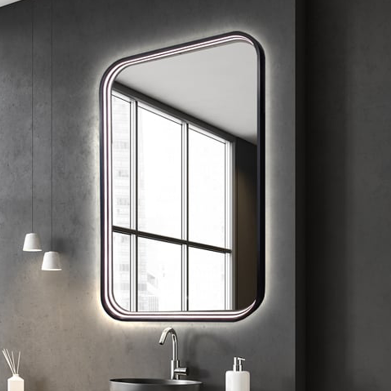 The Eminence Lighted Mirror from Electric Mirror in a primary bathroom.