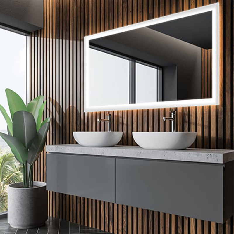 The Silhouette Lighted Mirror from Electric Mirror in a bathroom.