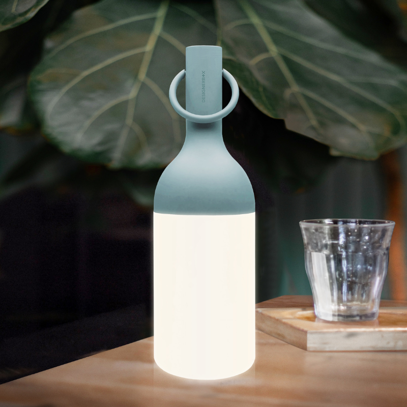The ELO Baby Portable Table Lamp by Bina Baitel for DesignerBox on a dining table.