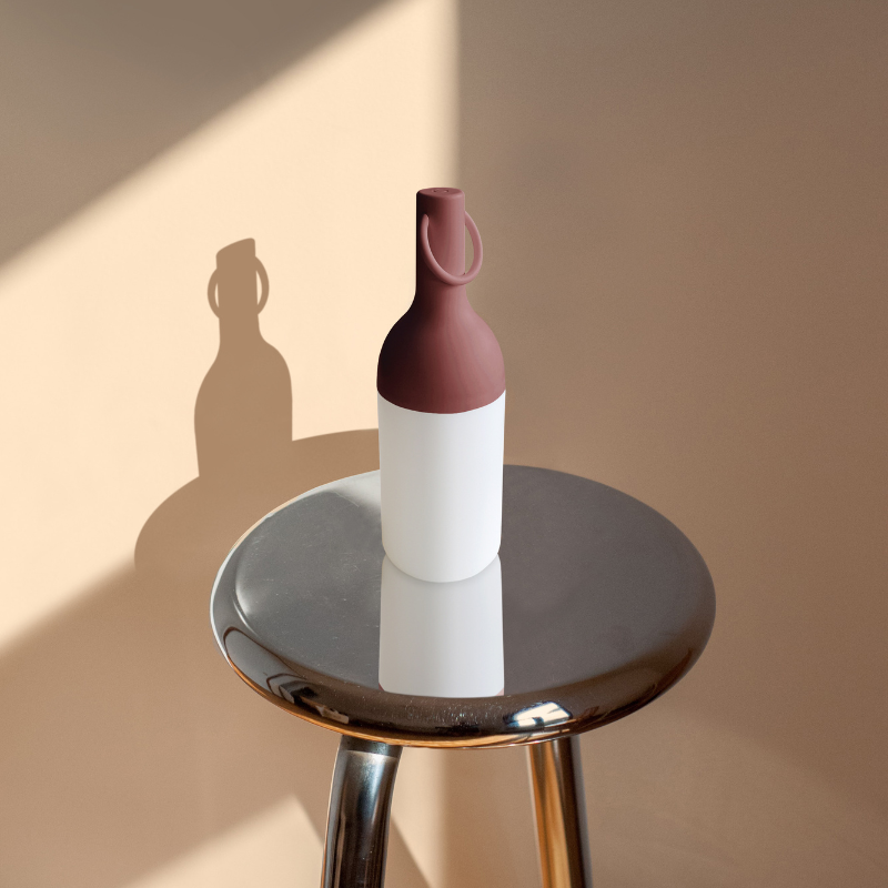 The ELO Baby Portable Table Lamp by Bina Baitel for DesignerBox in a family space.