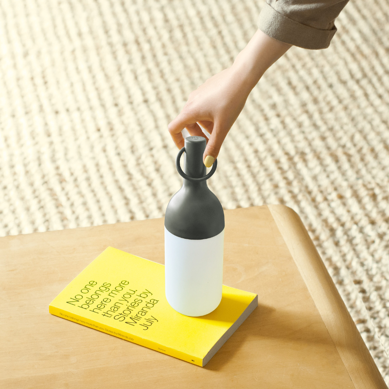 The ELO Baby Portable Table Lamp by Bina Baitel for DesignerBox in a living room.