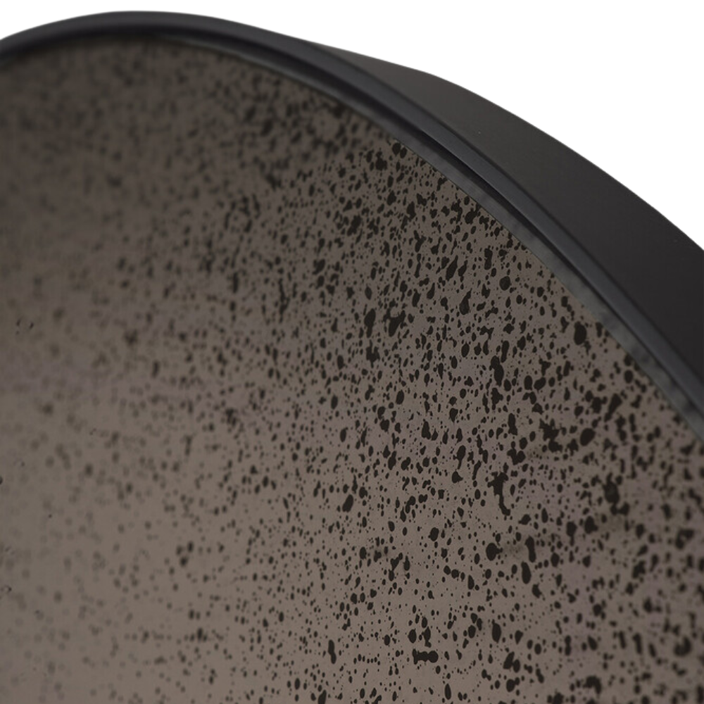 The Aged Wall Mirror Round bronze copper from Ethnicraft with a close-up from the side.