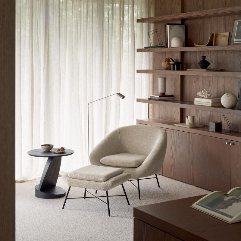 The Barrow Footstool from Ethnicraft in a living room.