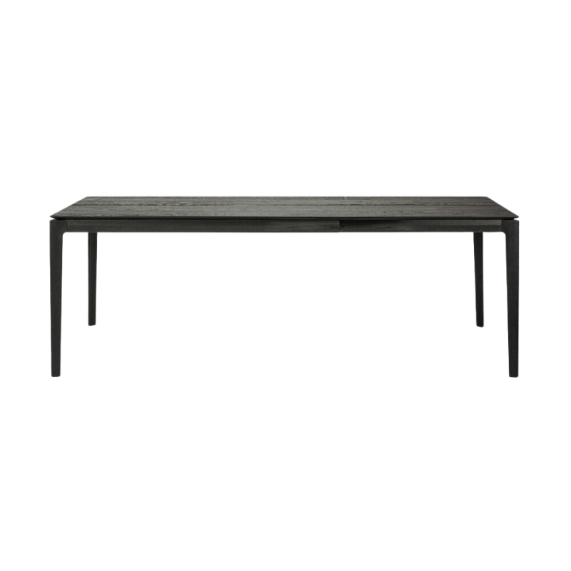 The 55 to 87 inch Bok Extendable Dining Table from Ethnicraft in black oak extended.