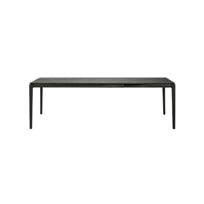 The 63 to 96 inch Bok Extendable Dining Table from Ethnicraft in black oak extended.
