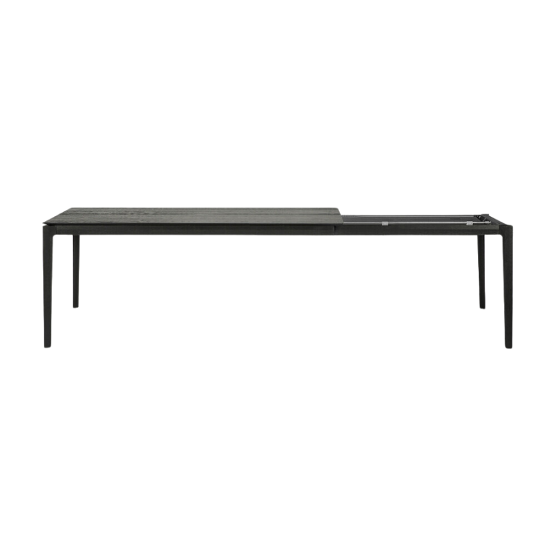 The 79 to 118 inch Bok Extendable Dining Table from Ethnicraft in black oak collapsed.
