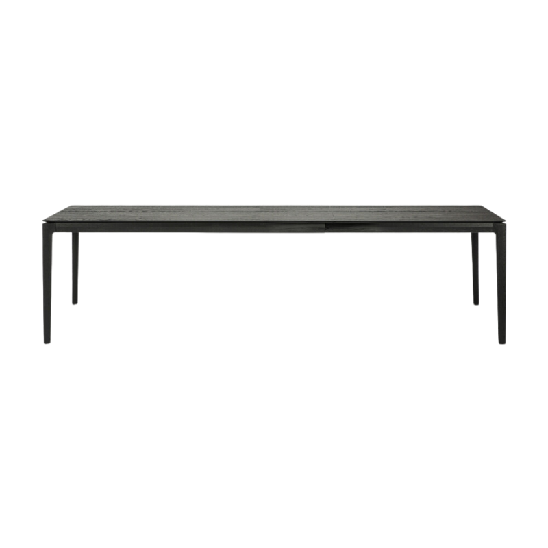 The 79 to 118 inch Bok Extendable Dining Table from Ethnicraft in black oak extended.