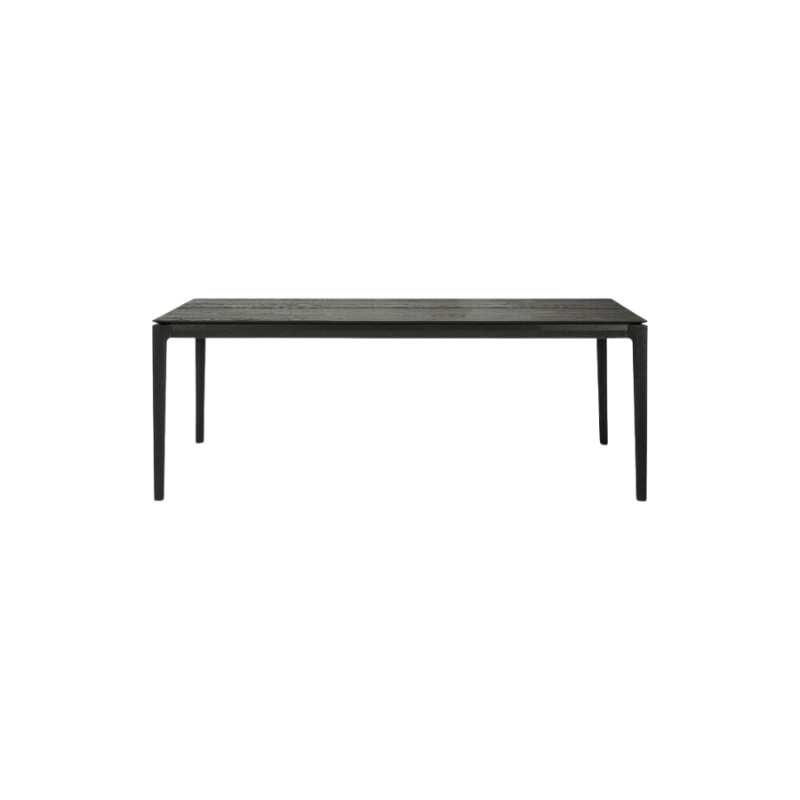 The 79 to 118 inch Bok Extendable Dining Table from Ethnicraft in black oak.