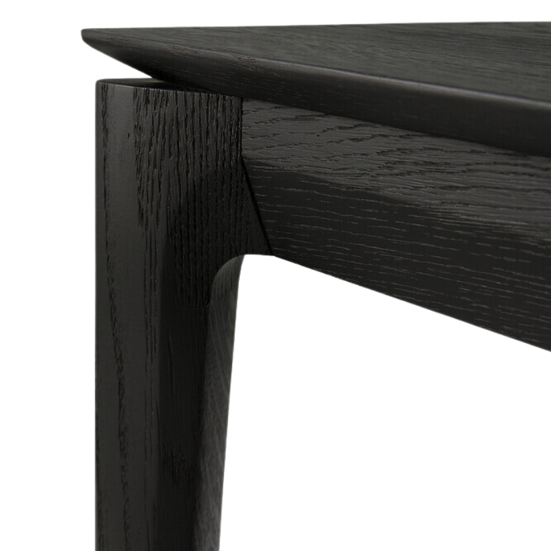 The Bok Extendable Dining Table from Ethnicraft in black oak corner.