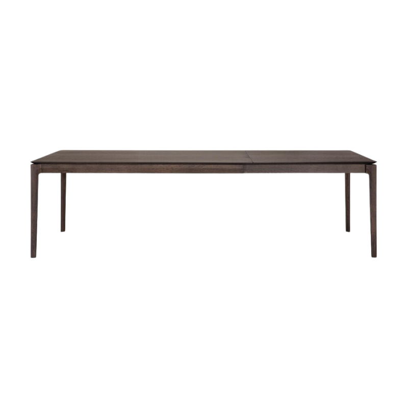 The 71 to 110 inch Bok Extendable Dining Table from Ethnicraft in brown oak extended.