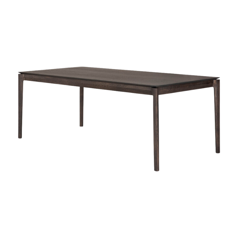The 79 to 118 inch Bok Extendable Dining Table from Ethnicraft in brown oak from an angle.