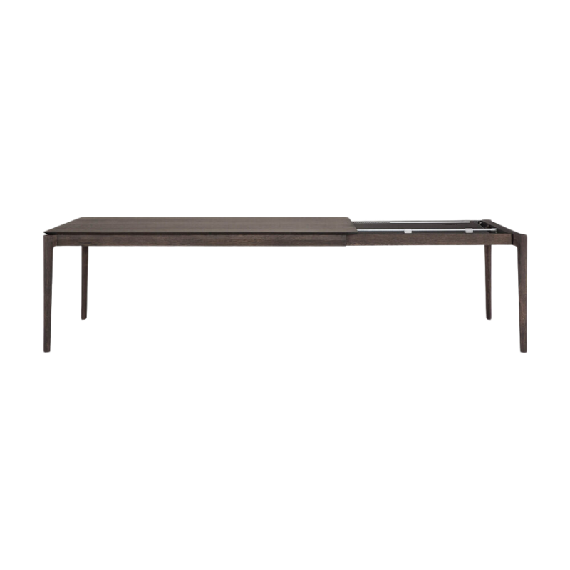 The 79 to 118 inch Bok Extendable Dining Table from Ethnicraft in brown oak collapsed.