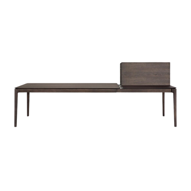 The 79 to 118 inch Bok Extendable Dining Table from Ethnicraft in brown oak collapsing.