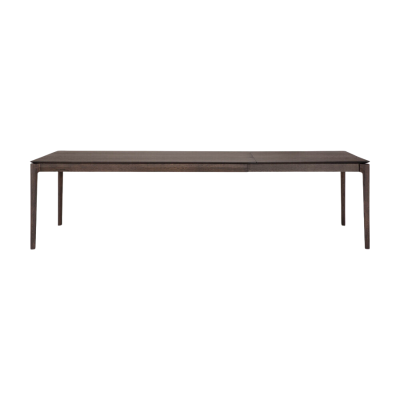 The 79 to 118 inch Bok Extendable Dining Table from Ethnicraft in brown oak extended.