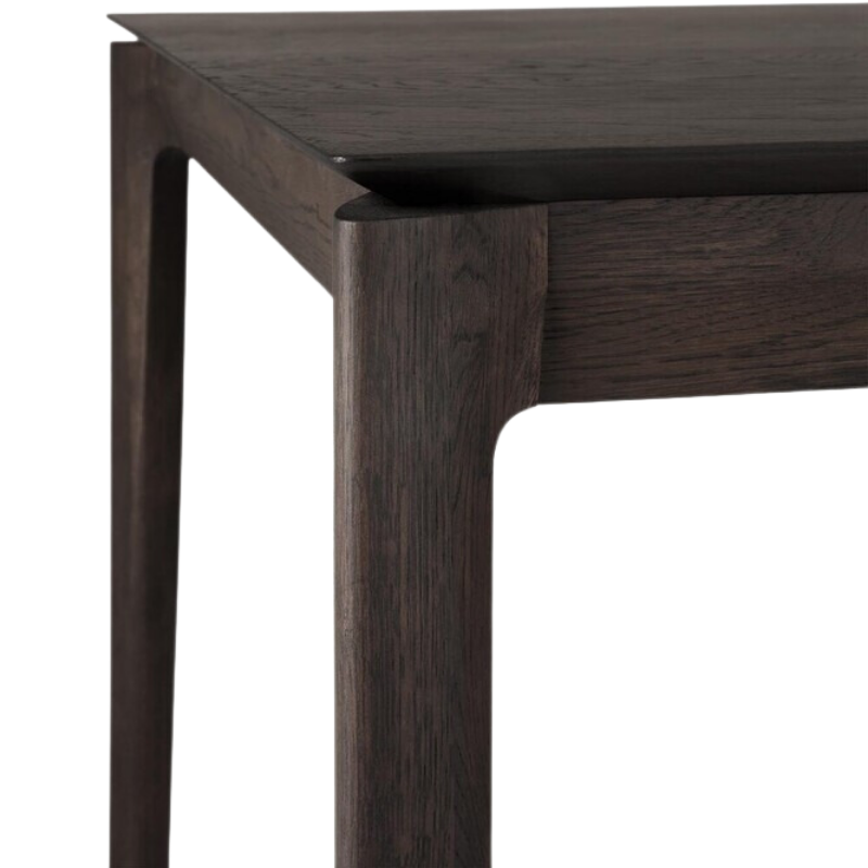 The Bok Extendable Dining Table from Ethnicraft in brown oak corner.