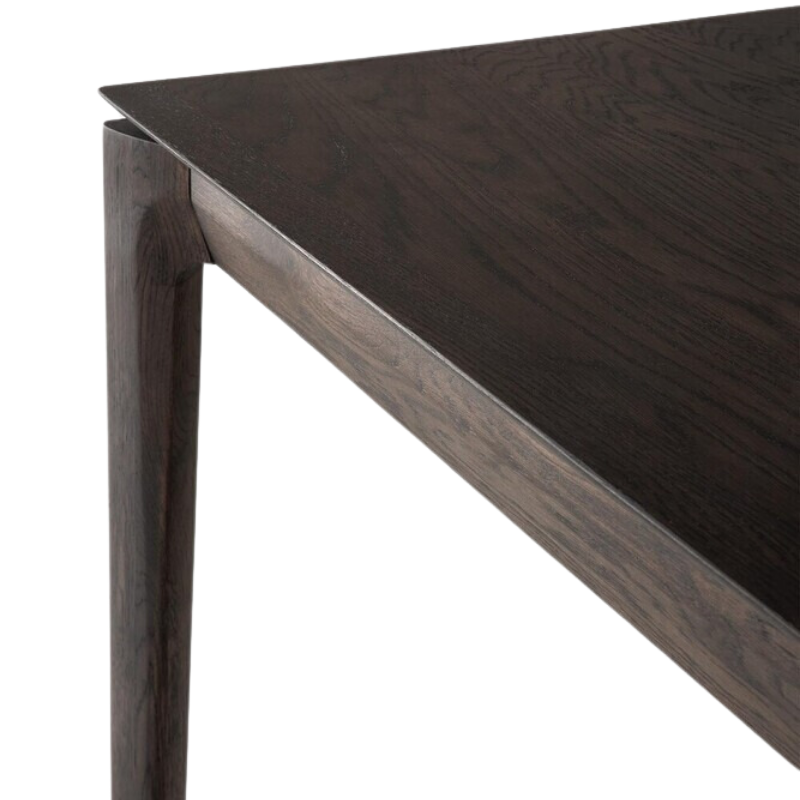 The Bok Extendable Dining Table from Ethnicraft in brown oak table top.